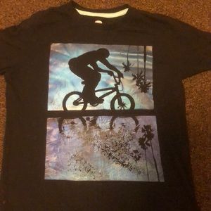 A black t-shirt with a bike and a kid having fun!!